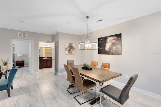 dining space with a notable chandelier and ornamental molding