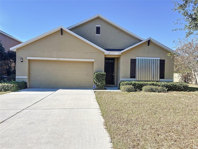 ranch-style house with a garage and a front yard