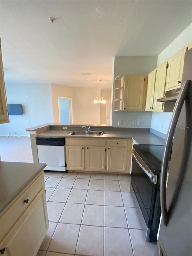 kitchen with decorative light fixtures, light tile patterned flooring, sink, and appliances with stainless steel finishes