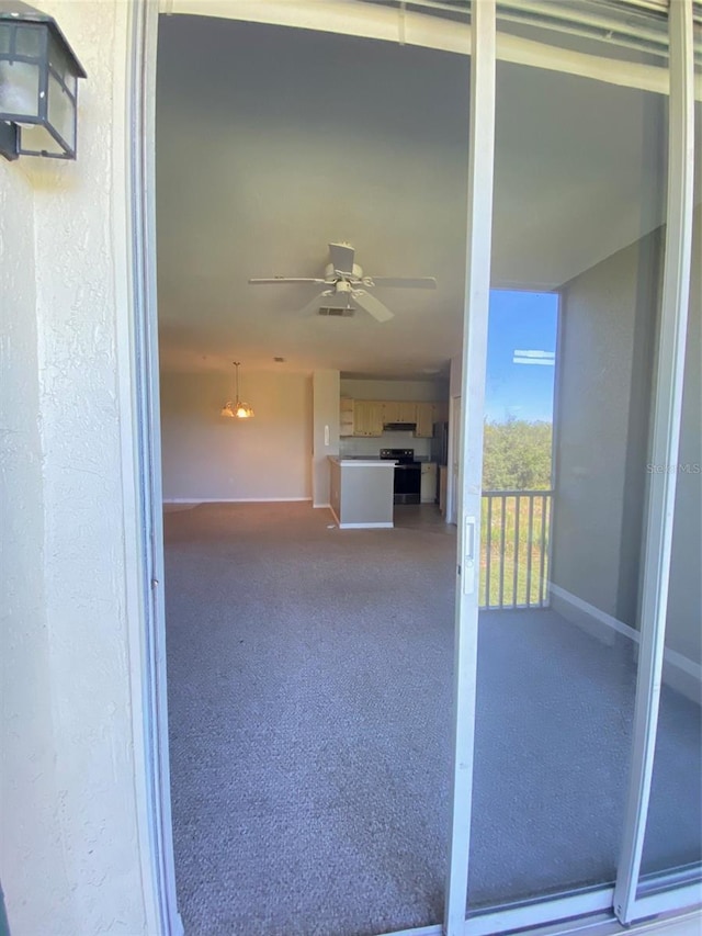 interior space featuring ceiling fan