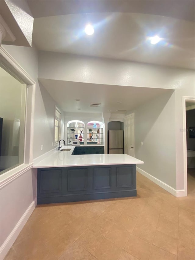 interior space with tile patterned floors and sink