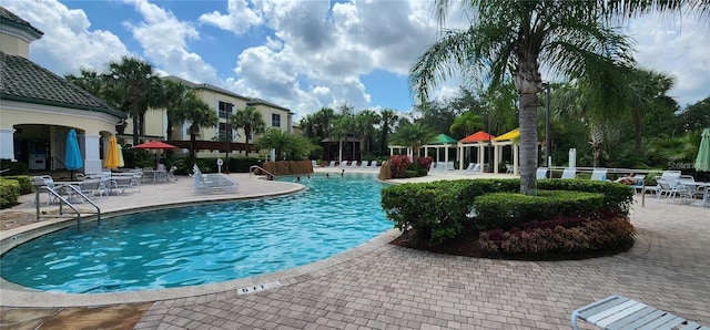 view of swimming pool with a patio area