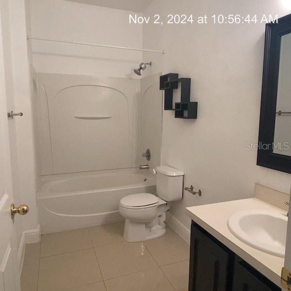 full bathroom with tile patterned flooring, vanity, bathing tub / shower combination, and toilet