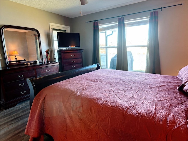 bedroom with a textured ceiling and ceiling fan