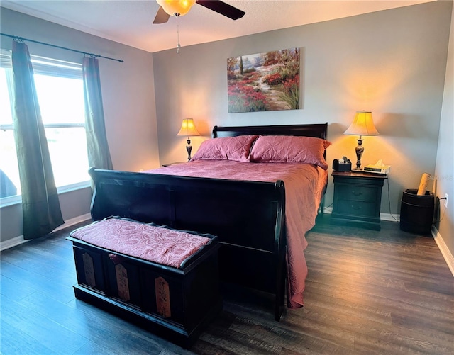 bedroom featuring ceiling fan and dark wood-type flooring