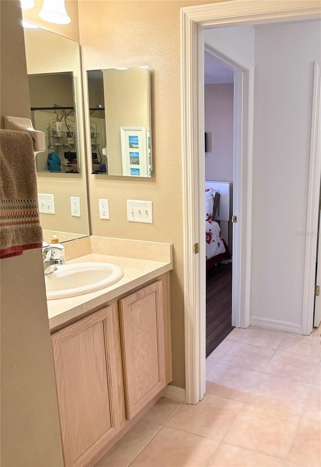 bathroom with vanity and tile patterned floors