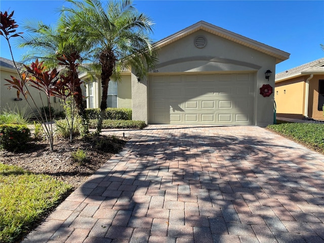 single story home with a garage