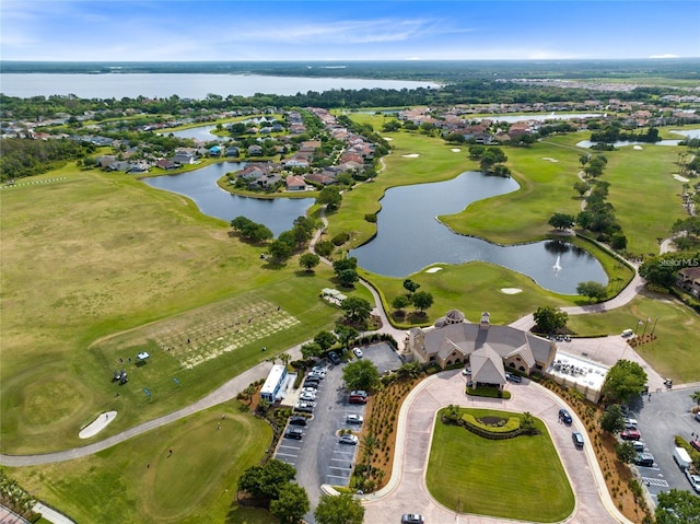 bird's eye view featuring a water view and view of golf course