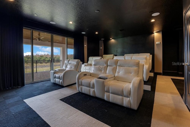 carpeted cinema featuring a textured ceiling and recessed lighting