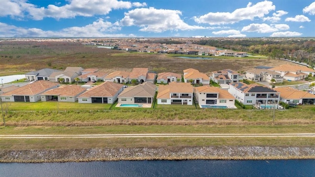 aerial view featuring a residential view and a water view