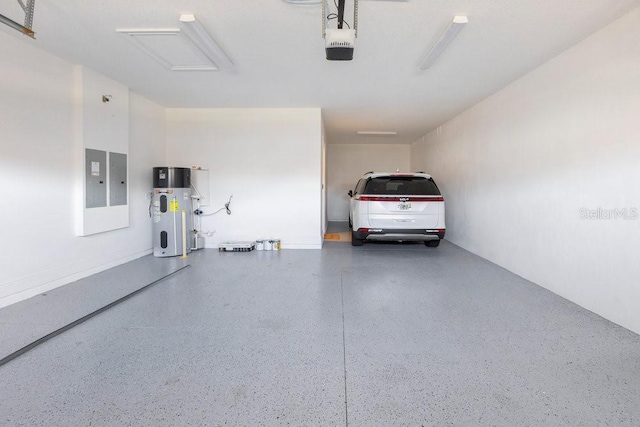 garage featuring a garage door opener and water heater