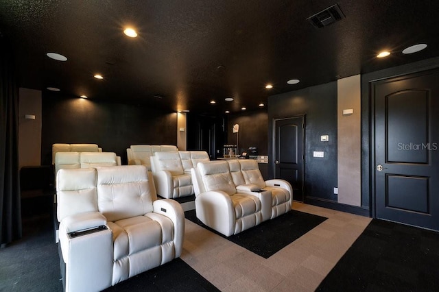 carpeted home theater featuring baseboards, visible vents, and recessed lighting