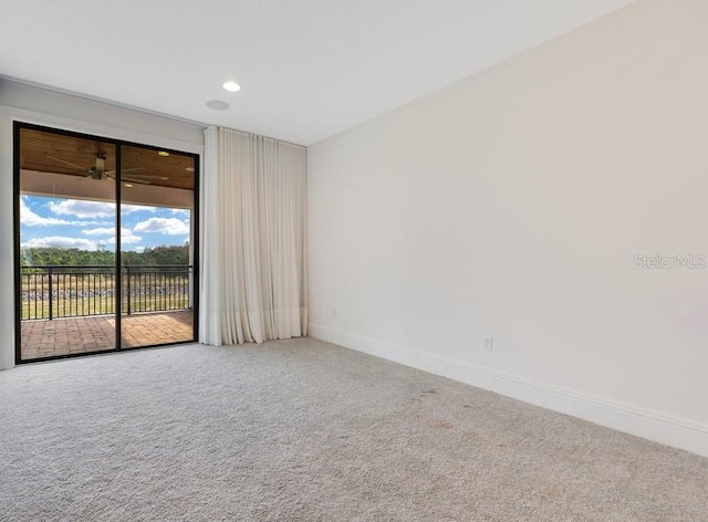 carpeted empty room with recessed lighting and baseboards