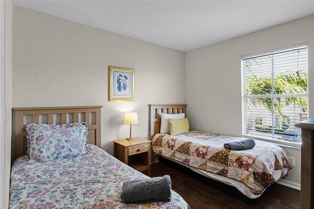 bedroom featuring dark hardwood / wood-style floors