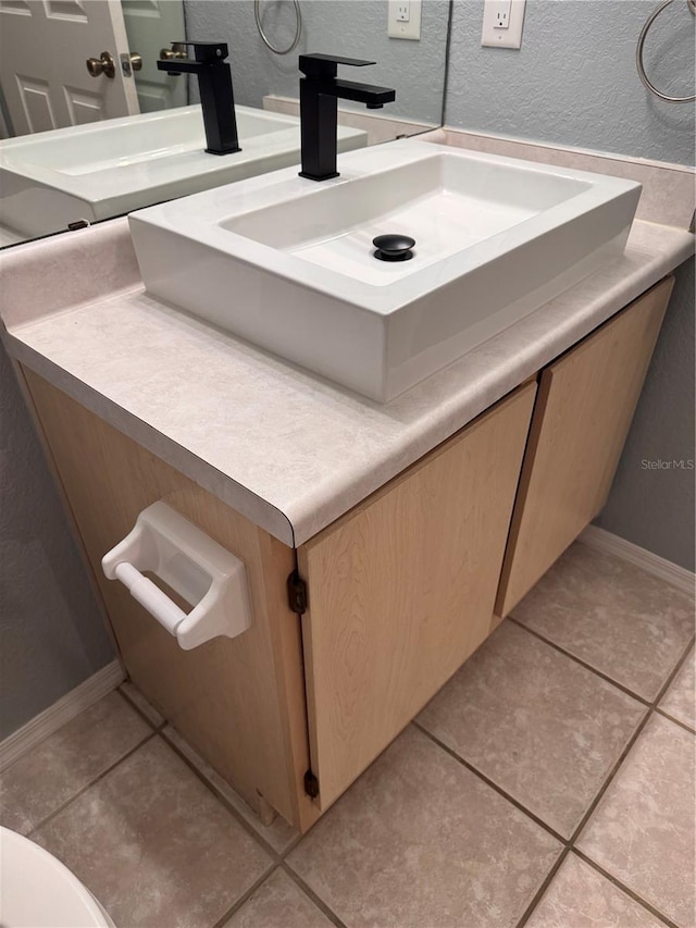 bathroom featuring vanity and tile patterned floors