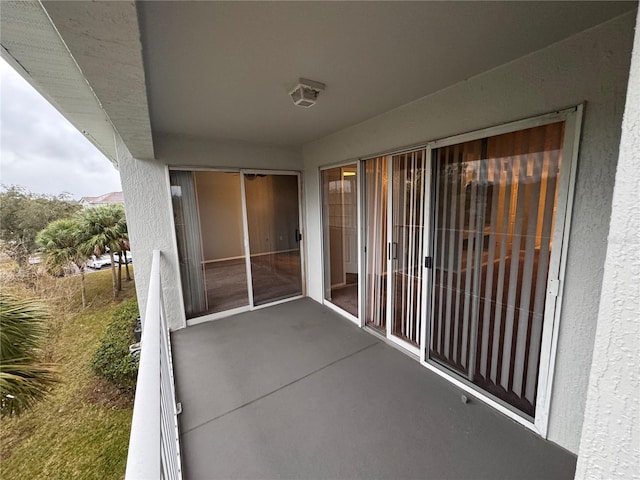 view of patio featuring a balcony