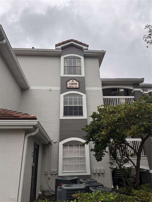 exterior space featuring a balcony and central AC