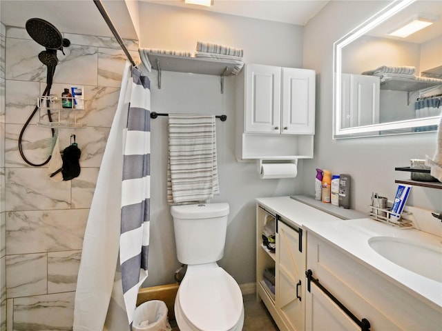 bathroom featuring toilet, vanity, and a shower with shower curtain