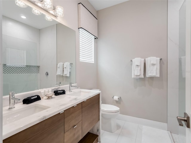 bathroom featuring tile patterned flooring, vanity, tiled shower, and toilet