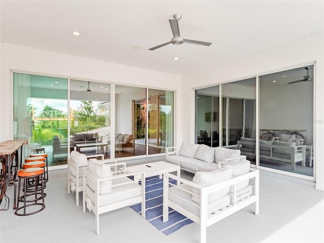 view of patio / terrace with ceiling fan and an outdoor hangout area