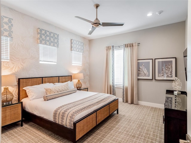 bedroom with ceiling fan and carpet floors