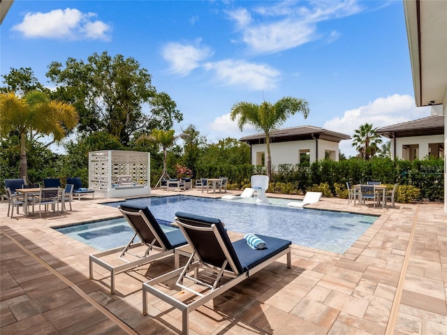 view of swimming pool with a patio area and pool water feature