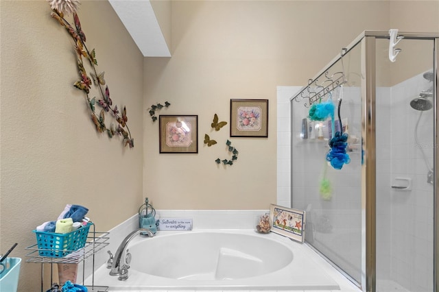 bathroom featuring separate shower and tub