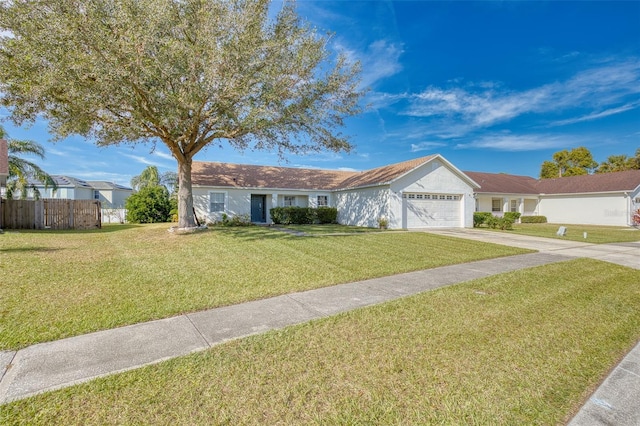 ranch-style home with a front lawn and a garage