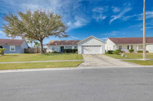 ranch-style house featuring a garage and a front lawn