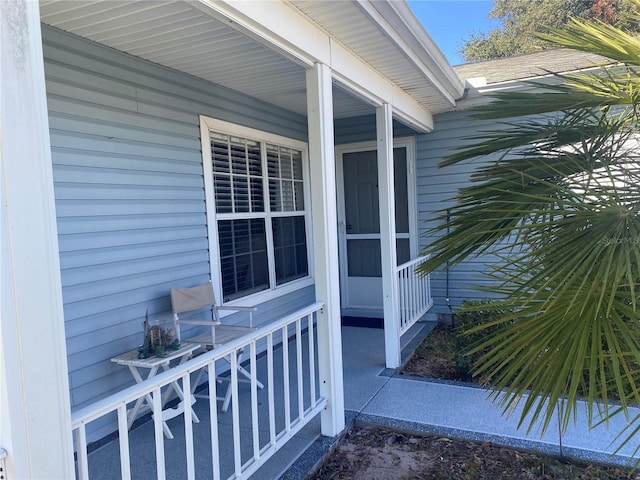 view of exterior entry featuring a porch