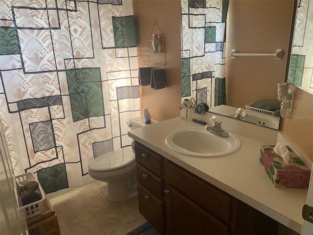 bathroom with tile patterned floors, vanity, and toilet