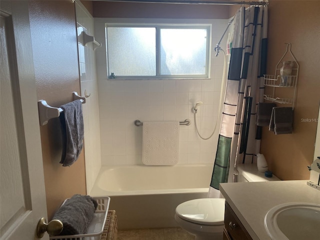 full bathroom with shower / bathtub combination with curtain, vanity, and toilet