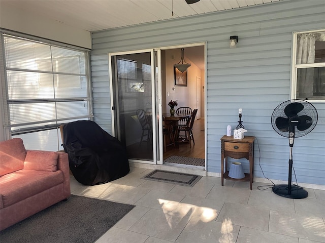 sunroom / solarium featuring wood ceiling