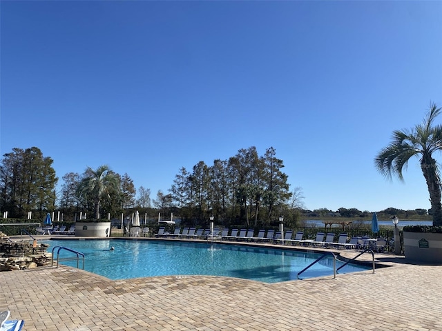 view of swimming pool featuring a patio area