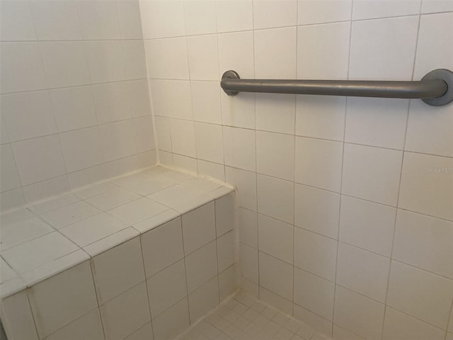 bathroom with tiled shower