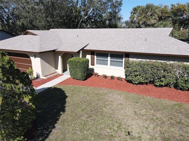 view of property exterior featuring a lawn and a garage