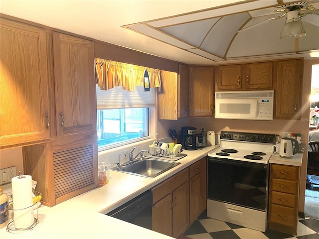 kitchen featuring ceiling fan, white appliances, and sink