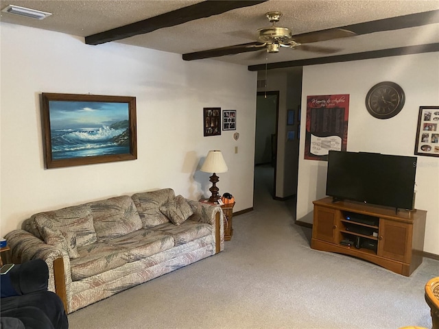 carpeted living room featuring beam ceiling, a textured ceiling, and ceiling fan