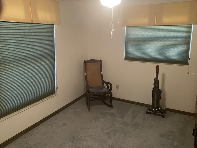 living area with dark carpet