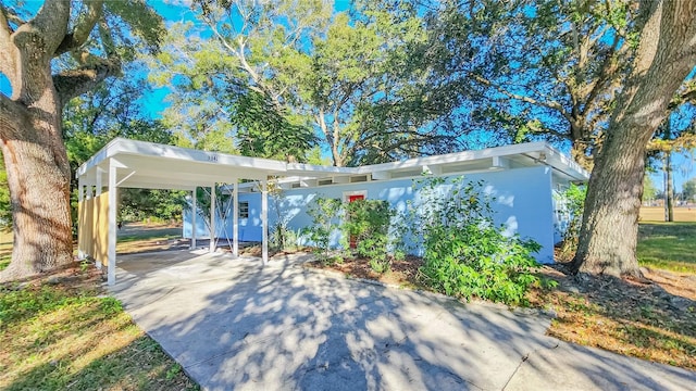 exterior space featuring a carport