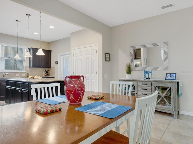 tiled dining space with sink