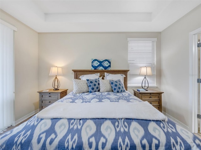 bedroom with a tray ceiling