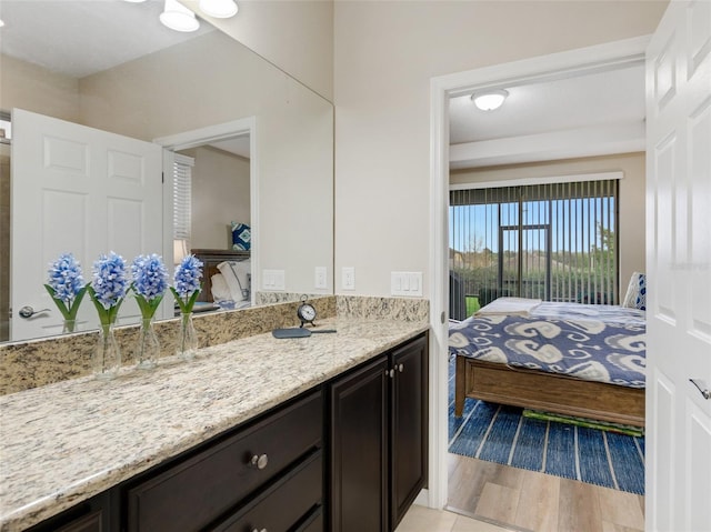 bathroom featuring vanity and hardwood / wood-style flooring