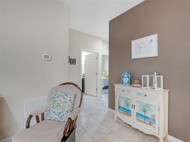 living area featuring light tile patterned floors