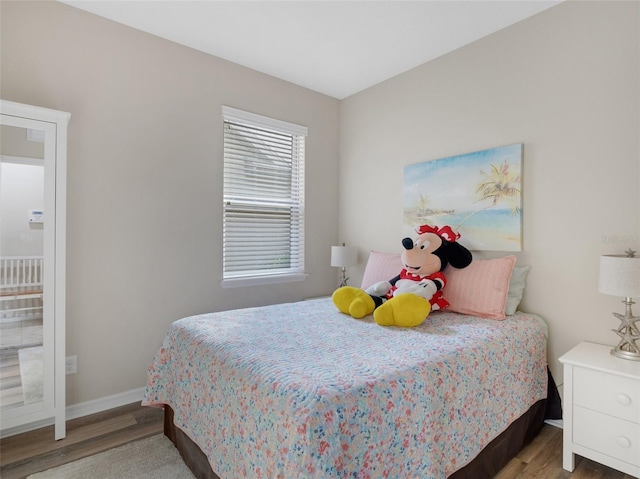 bedroom with hardwood / wood-style floors