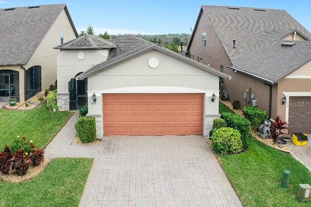 view of front of house featuring a front yard and a garage