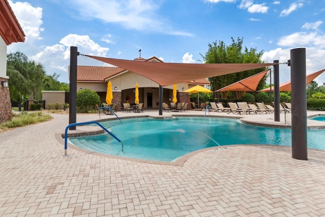 view of swimming pool featuring a patio area