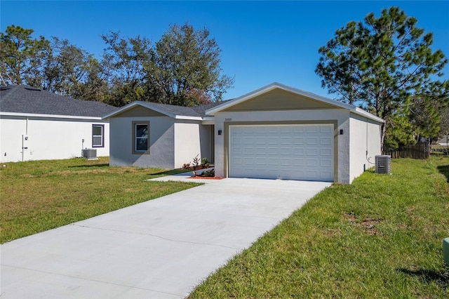 ranch-style house featuring a garage, concrete driveway, central AC unit, and a front yard