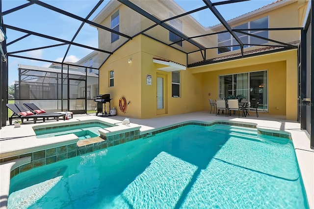 view of pool with a patio area, a lanai, and an in ground hot tub