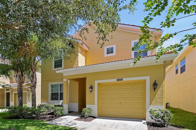 mediterranean / spanish-style house featuring a garage